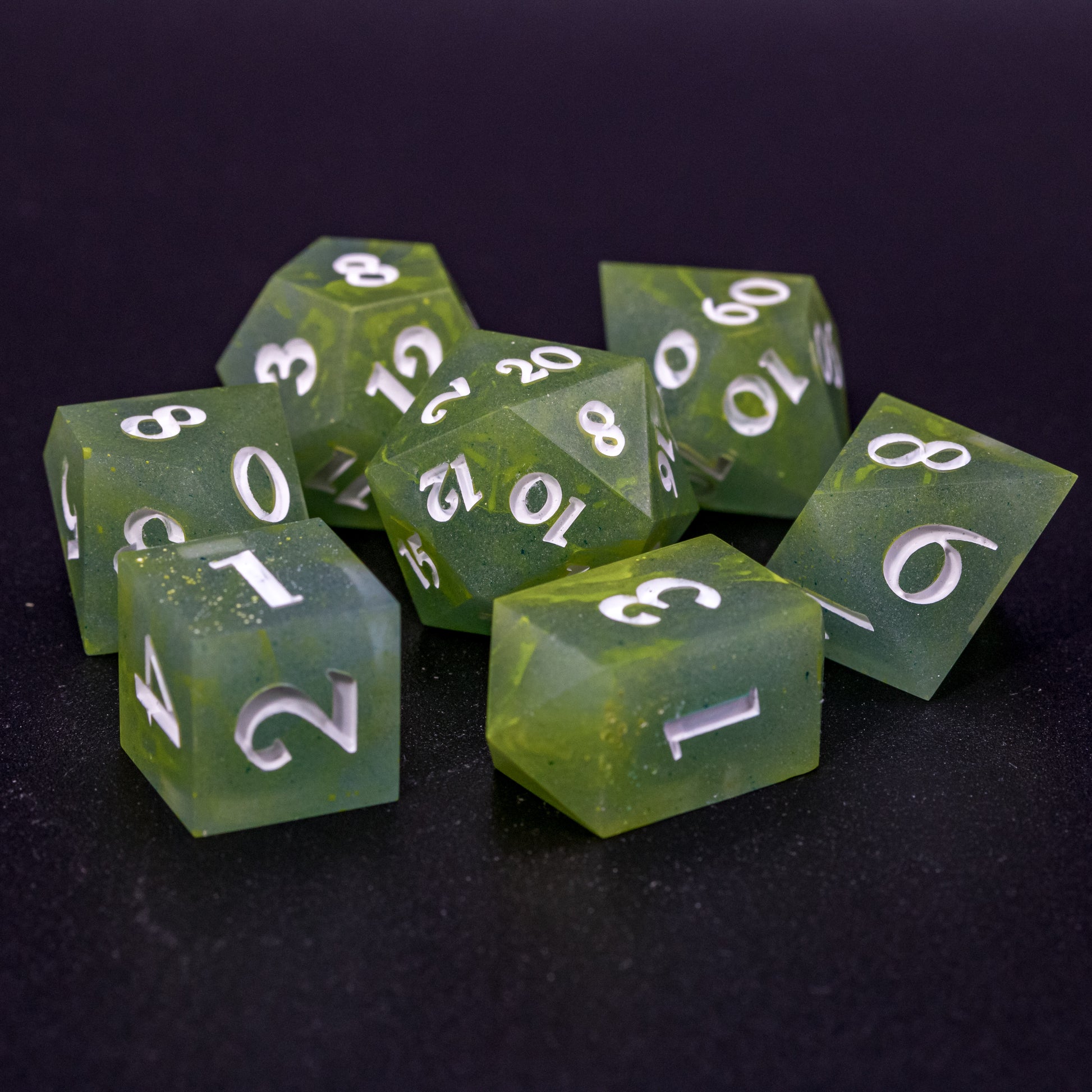 All Bog Brew dice sitting in a circle with D20 centred, featuring white numbers, yellow-green swirls on blue-green base resin.