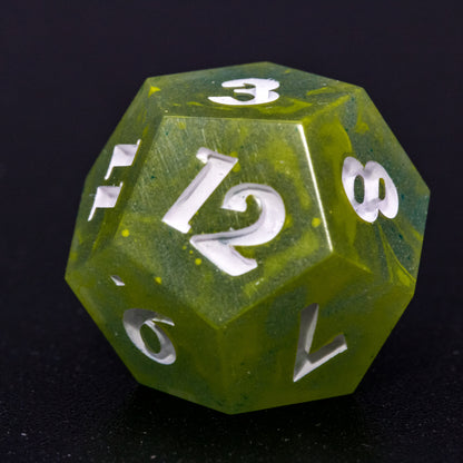 Close up of D12 Bog Brew die, featuring white numbers, yellow-green swirls on blue-green base resin.